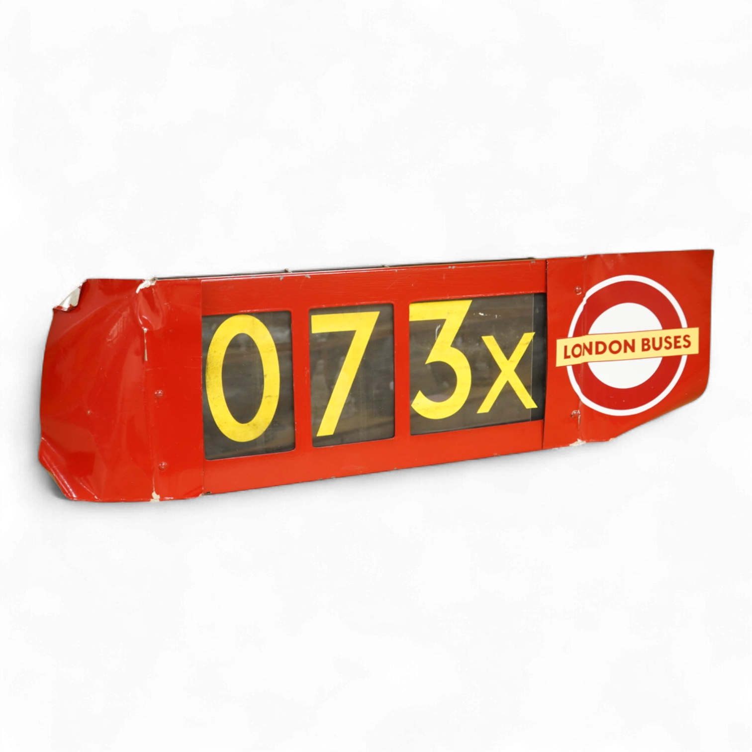 A London Transport bus destination blind box, complete with mechanism and three numerical destination blinds, with later applied sheets of red painted steel bolted to each side, mechanism with winding handle and row sele